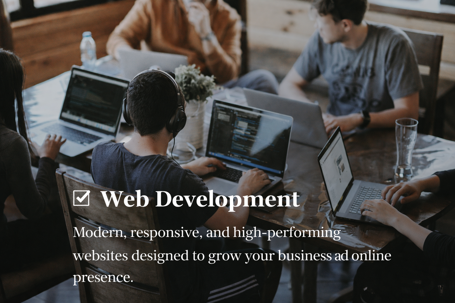 Professional web development workspace with modern website design and coding screens